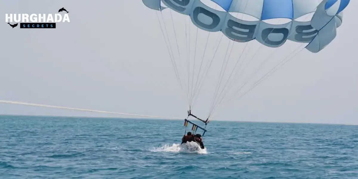 A tourist enjoying a parasailing adventure over the Sea