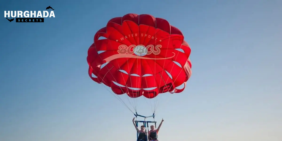 2 tourist enjoying a parasailing adventure over the Sea