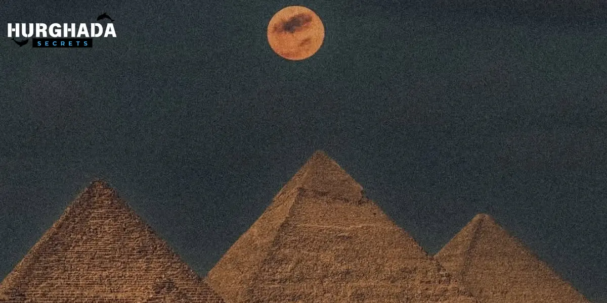 The pyramids have the moon above them