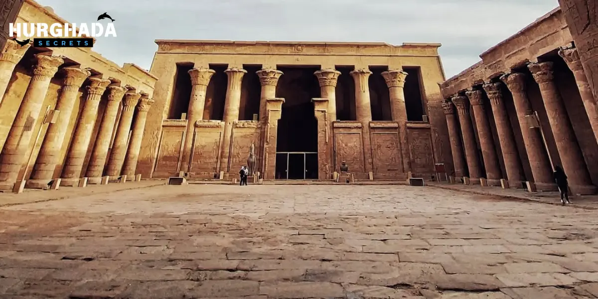 Front view of an ancient Egyptian temple with tall stone columns and an open courtyard